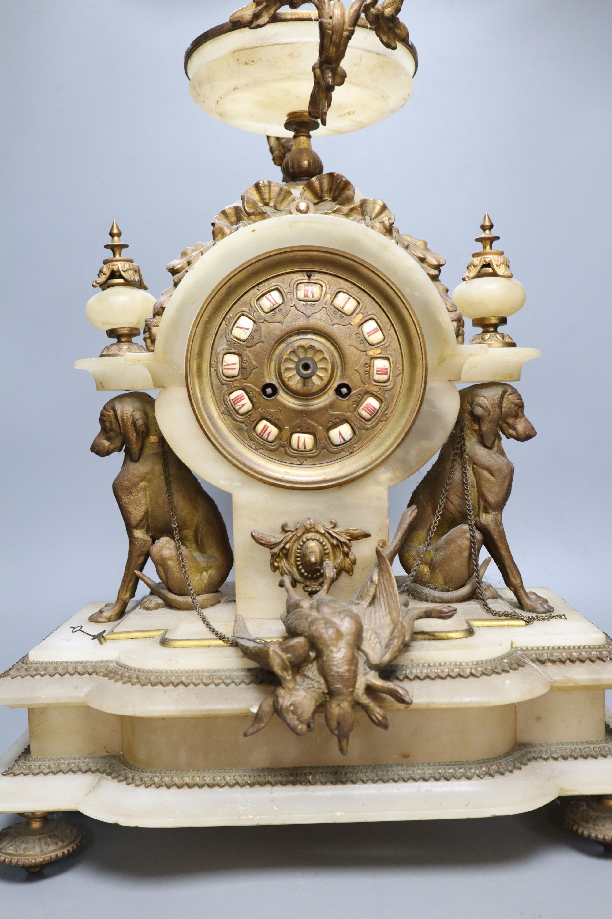 A French gilt metal and alabaster mantel clock, height 49cm